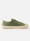 Side view of a Novesta for Universal Works Olive Canvas Star Master shoe on a white background. The shoe is olive green with a cream sole and laces.