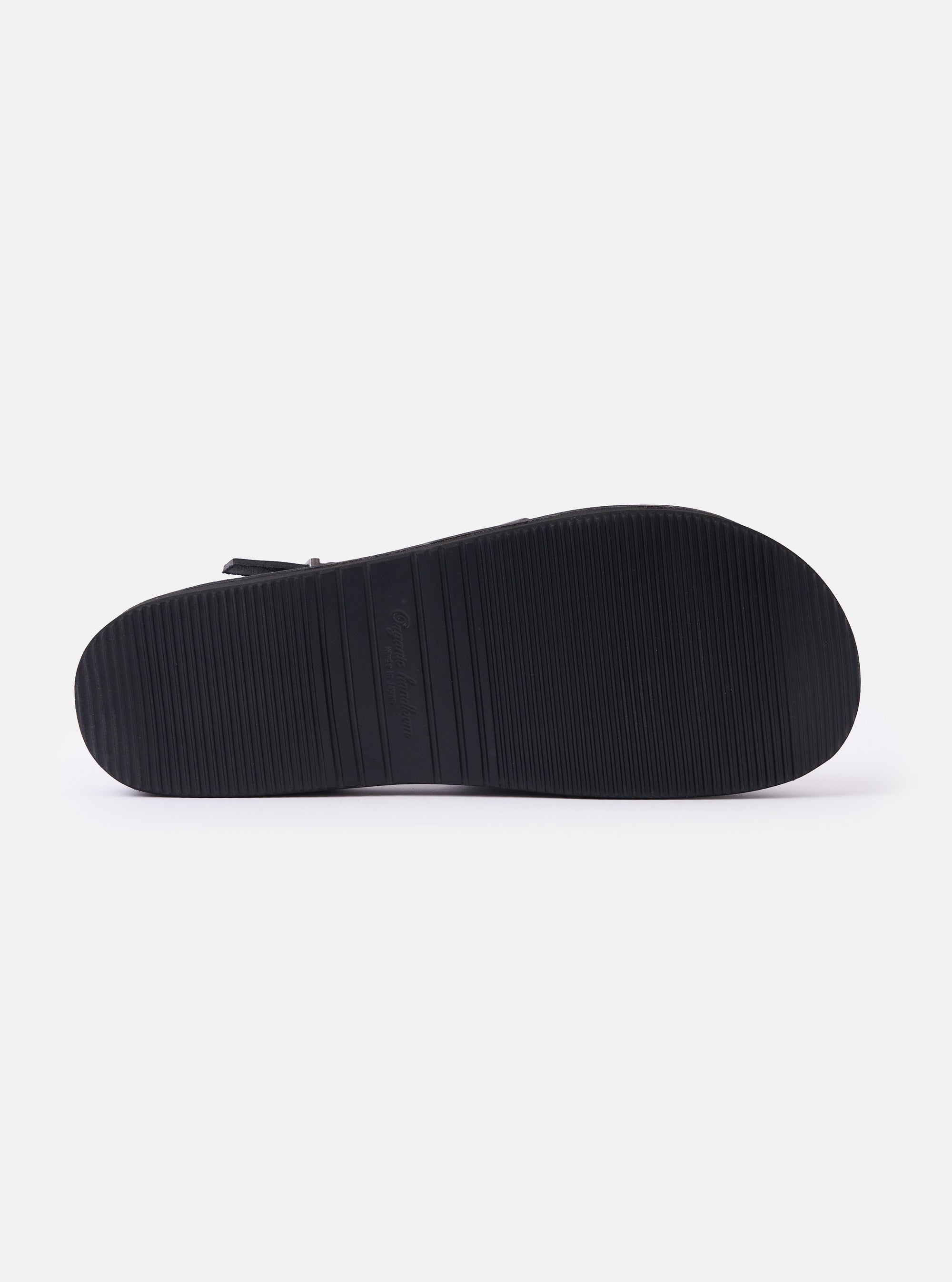 The Organic Handloom Black Leather Gurkha is shown in a detail view as a flat lay against a plain white background. The image focuses on the bottom of the shoe, highlighting the black foam rubber outsole and its textured tread pattern designed for grip and durability.