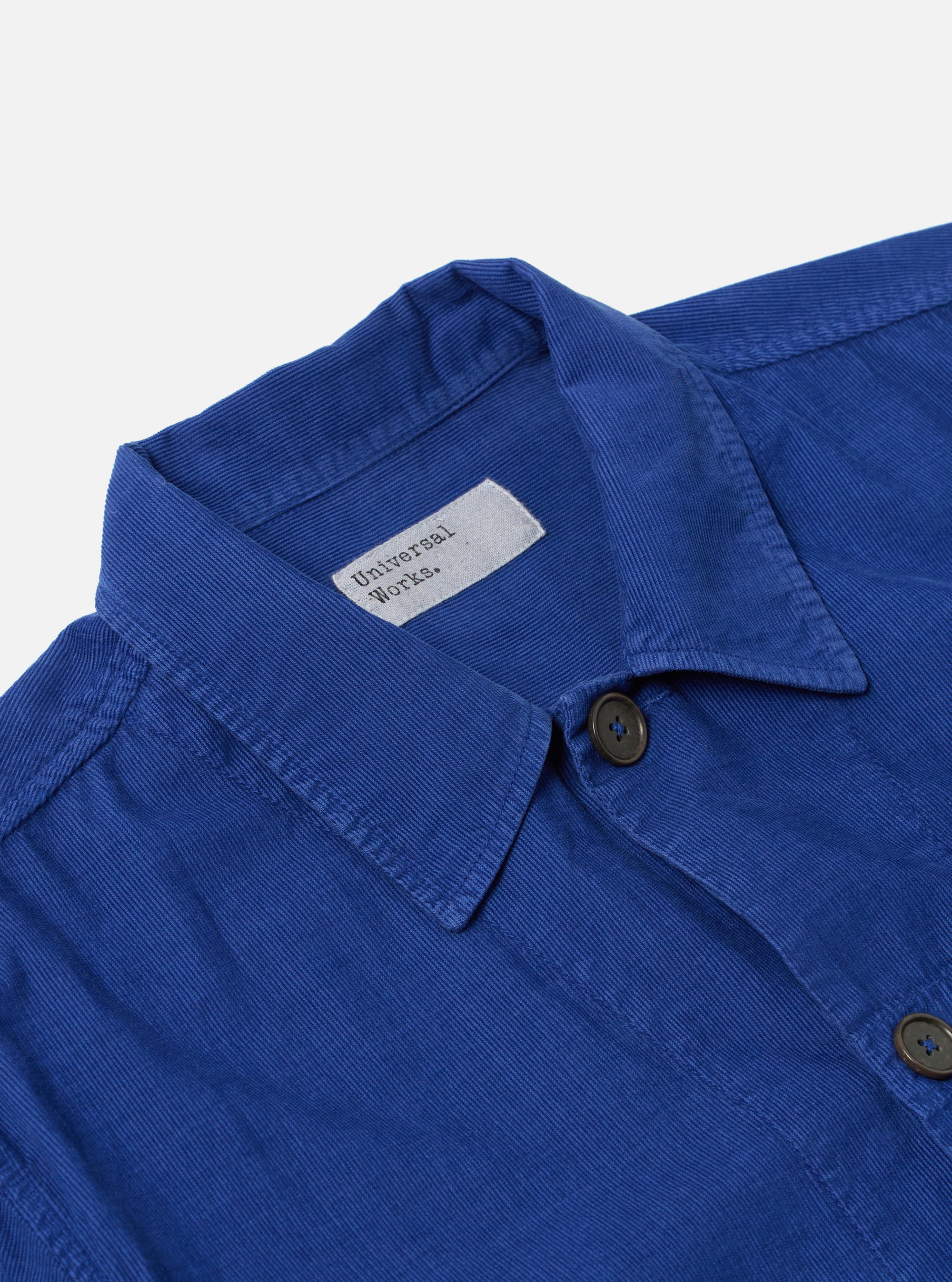 Close-up of the Work Blue Summer Cord Tech Overshirt on a white background. The blue corduroy texture and button details are clearly visible.