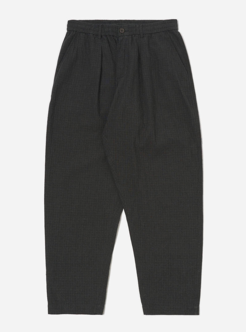 Studio shot of Charcoal Fine Linen Mix Pleated Track Pant on a white background. The pants are a dark charcoal color and have a relaxed fit.
