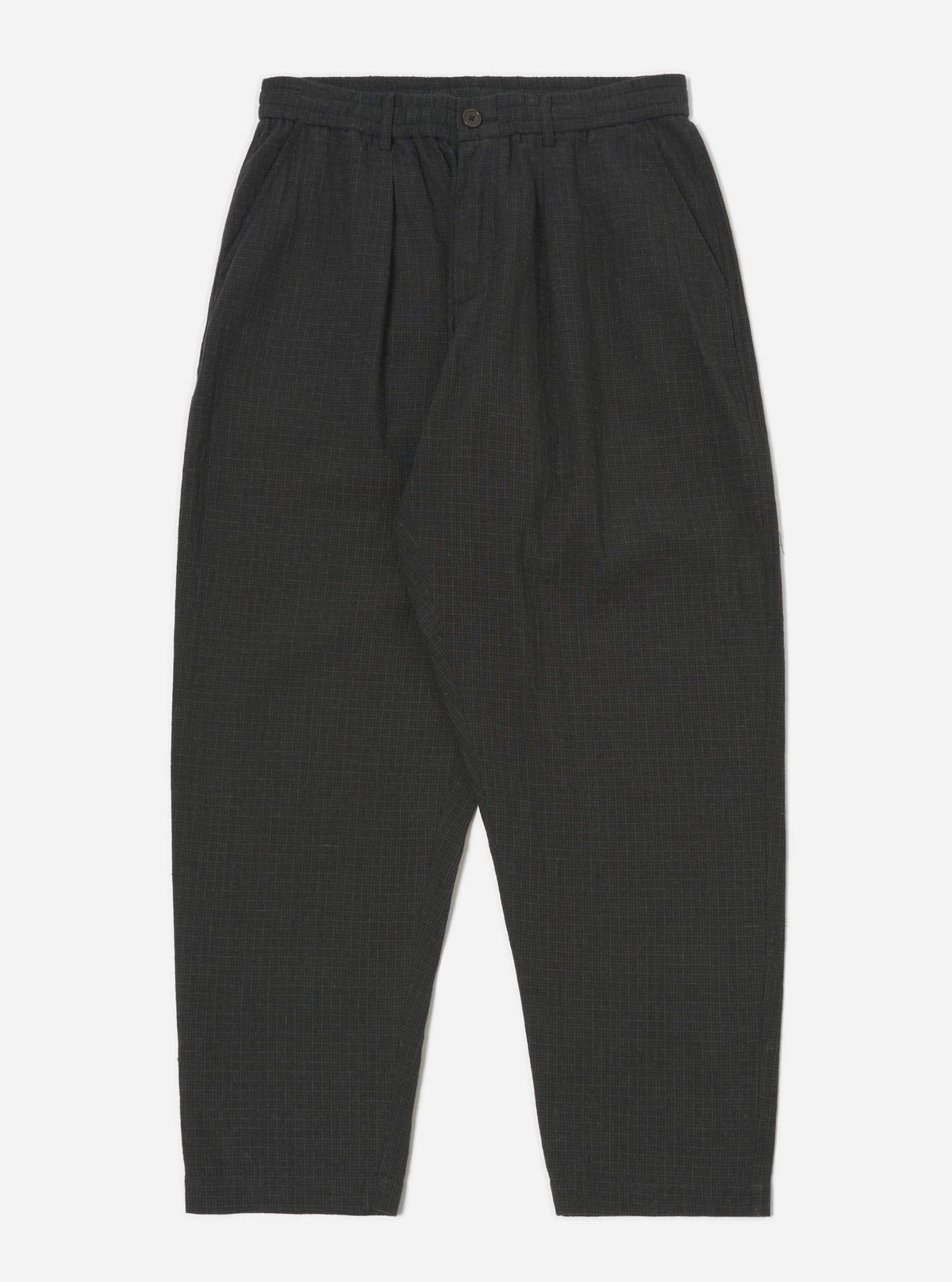 Studio shot of Charcoal Fine Linen Mix Pleated Track Pant on a white background. The pants are a dark charcoal color and have a relaxed fit.