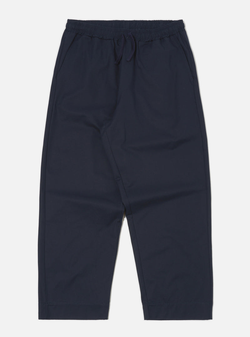 Studio shot of the Navy Military Cotton Judo Pant on a white background. These loose-fitting, navy cotton pants feature an elastic waist with a drawstring.