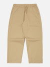 The Sand Military Cotton Judo Pant in sand color, made of cotton, laid flat on a white background. Features a drawstring waist and a relaxed fit.