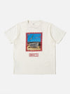 The Ecru/Red Single Jersey Pickup Print Tee on a white background. The tee is ecru with a red print of a building and text. The jersey material looks soft and comfortable.