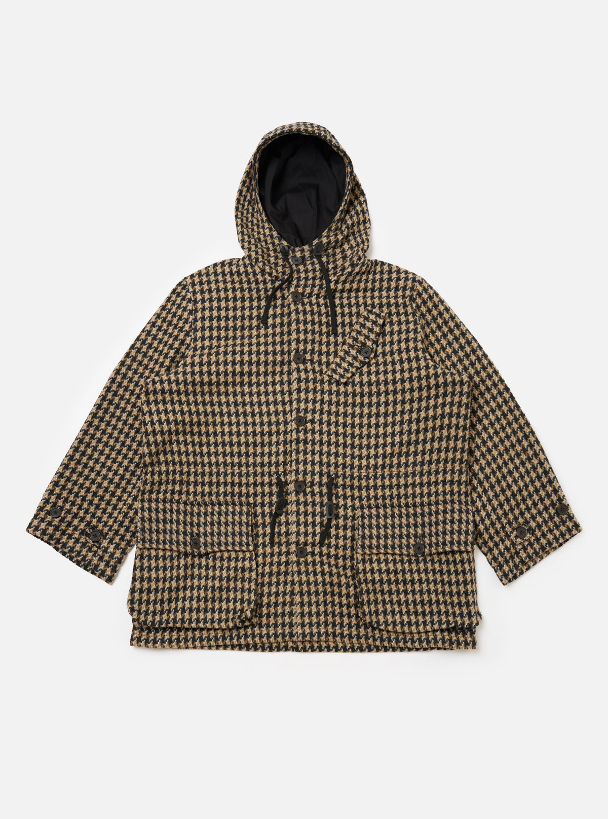 The Sand Cortina Tweed Boston Parka on a white background. The parka is tweed with a black and tan houndstooth pattern. It has a hood and button closure.