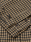 Close-up of the Sand Cortina Tweed Boston Parka showing the tweed fabric and button details. The background is a plain surface.