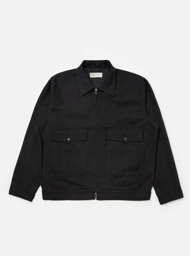 The Black Organic Canvas S130 Jacket, a zip-up jacket with two front pockets, displayed on a white background.