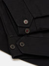 Close-up of the Black Organic Canvas S130 Jacket showing the black canvas material and buttons with red detail on a white background.