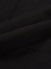 Close-up of the Black Organic Canvas S130 Jacket, showcasing the texture and weave of the material. The fabric is draped to highlight its quality.