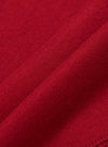 Close-up of the Red Single Jersey Funnel Neck Tee fabric. The soft, red jersey material is draped to show its texture and quality. The image highlights the tee's comfortable fit.