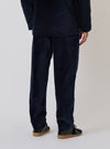 Back view of a model wearing the Navy Velveteen Military Chino and matching jacket. The chino is a relaxed fit. Studio shot on a white background.