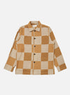 The Sand Japanese Patchwork Easy Jacket, featuring a tan and beige checkerboard pattern, is laid flat on a white background. The jacket has long sleeves and a button-up front.