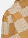 Close-up of the Sand Japanese Patchwork Easy Jacket showing the textured fabric in tan and cream tones. The jacket is on a white background.