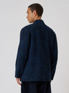 A man in a Black/Indigo Denim Camo Kyoto Work Jacket, back view, against a white backdrop. The jacket has a unique camo pattern and a relaxed fit.