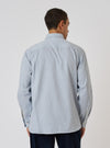 Back view of a model wearing a Sky Blue Brushed Organic Cotton Square Pocket Shirt. The shirt is on a white background.