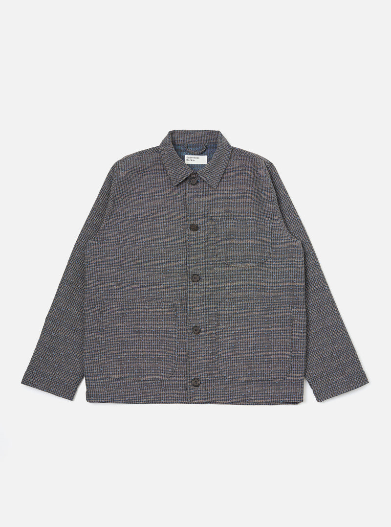 A Grey/Blue Jacquard Weave Field Jacket is shown laid flat against a solid white background. The garment features a textured jacquard-woven check pattern in shades of grey and blue, a classic pointed collar, a five-button front closure, and two large patch pockets at the waist.