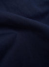 A close-up, square fabric swatch of the Navy Linen Slub Weave E130 Jacket highlights the detailed texture of the material. The fabric features a prominent slubbed yarn weave in a dark navy blue color, creating a slightly uneven and tactile surface. The swatch is shown as a flat, detailed material sample.