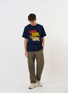 The Navy Single Jersey Multi UW Print Multi UW Print Tee is displayed flat against a plain white background. The navy blue t-shirt features a crew neck, short sleeves, and a prominent white graphic print repeating the initials UW across the front.