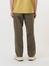 The back of a pair of Olive Linen Slub Weave Oxford Pants is shown from the waist down, laid flat against a plain white background. The image highlights the two rear pockets, consisting of one buttoned flap pocket and one buttoned jetted pocket, as well as the wide-leg cut.