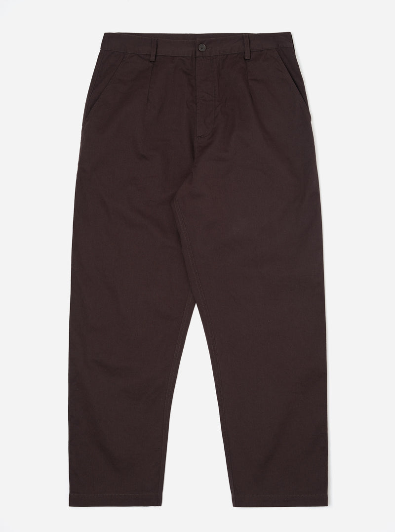 A pair of Brown Twill Dizzy Trousers is shown laid flat against a solid white background. The trousers feature a loose, wide-leg fit with a buttoned waistband and side slip pockets.