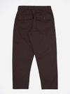 A pair of Brown Twill Dizzy Trousers is shown from the back, laid flat against a plain white background. The trousers feature a wide, slightly tapered leg and two prominent rear patch pockets with buttoned flaps.