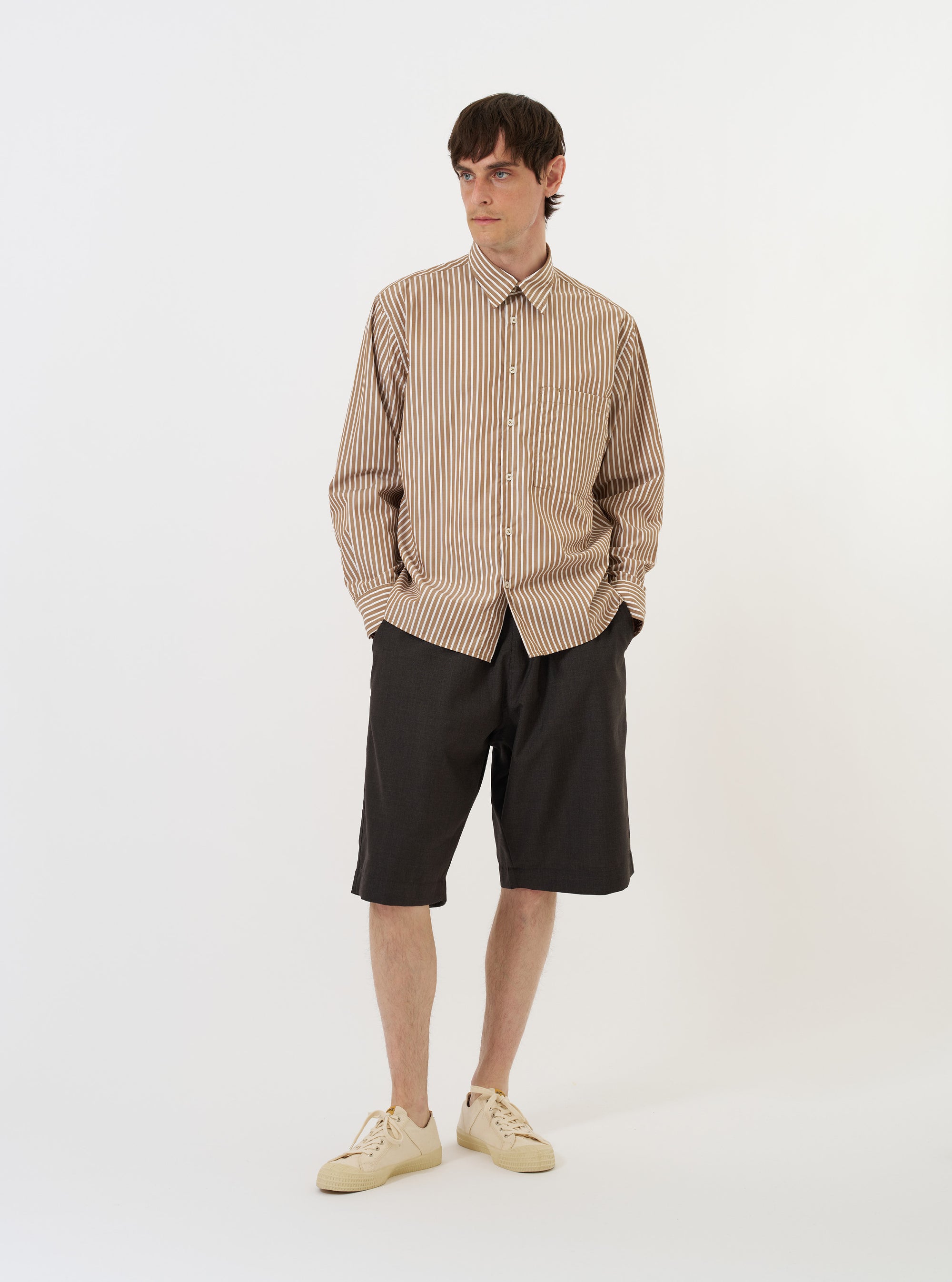 The Brown/White Cotton Stripe Square Pocket Shirt is displayed flat against a plain white background. The shirt features vertical brown and white stripes, a classic pointed collar, a full button-down front, and a single square patch pocket on the left chest.