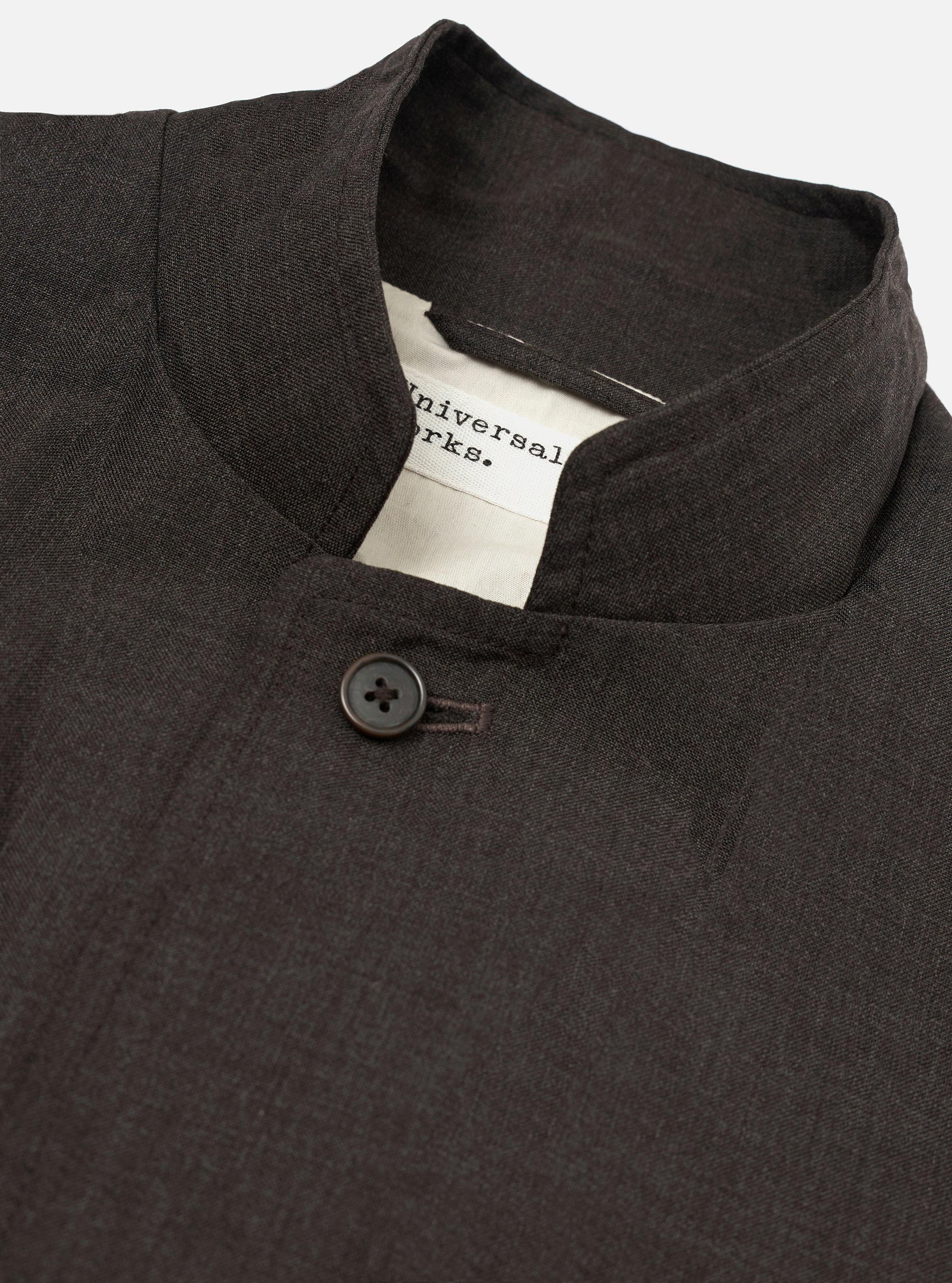 The Brown Marl Tropical Suiting Two Button Jacket is shown from the back, laid flat against a plain white background. The image highlights the jacket's relaxed structure, two-piece sleeves, and side vents at the hem.