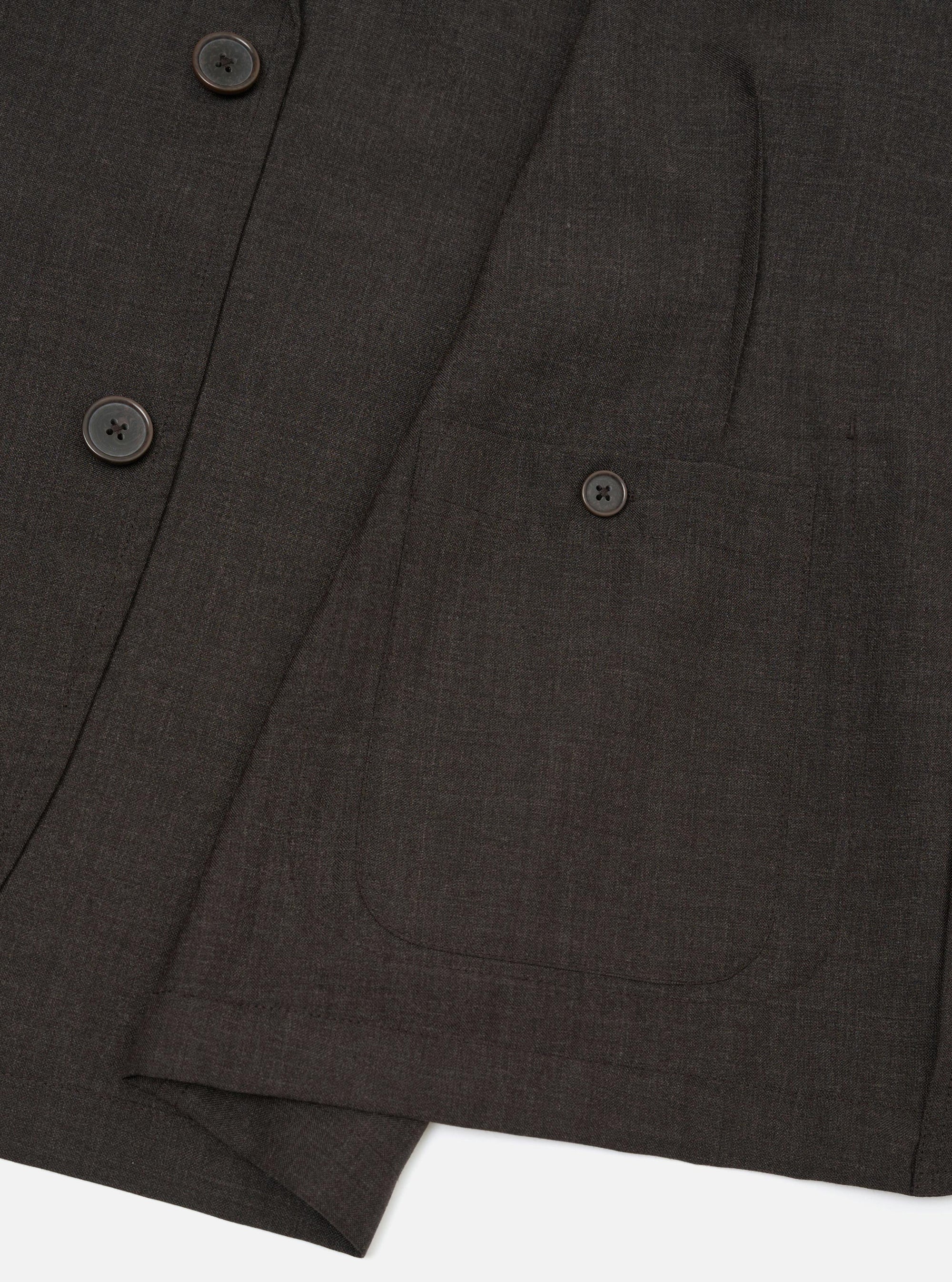 The Brown Marl Tropical Suiting Two Button Jacket is shown from the back, laid flat against a plain white background. The image highlights the clean construction of the shoulders, the central seam, and the straight hem of the garment.