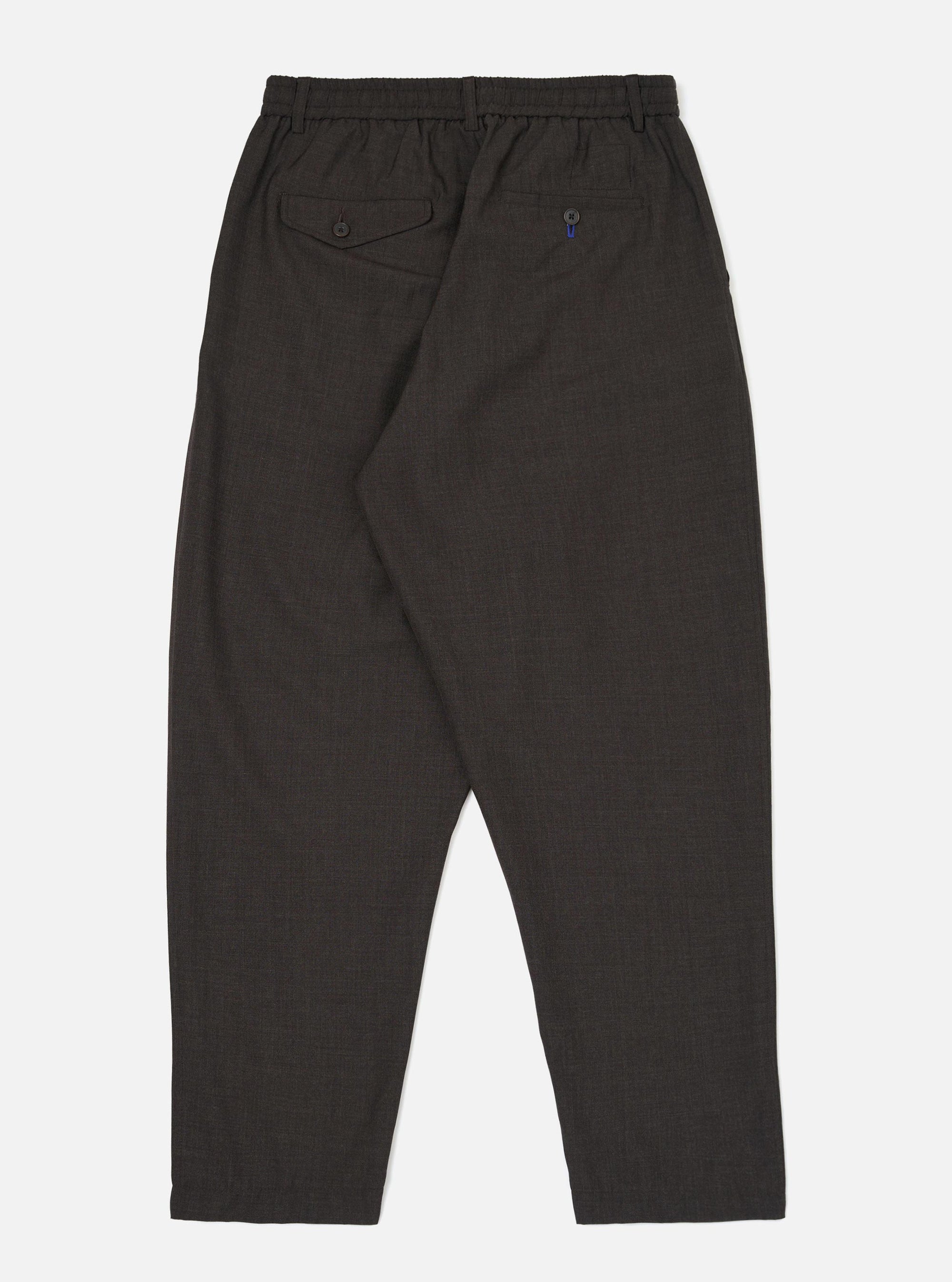 The back of the Brown Marl Tropical Suiting Pleated Track Pant is displayed flat against a plain white background. The trousers feature a tapered leg, an elasticated waistband, and two distinct rear pockets, including one with a buttoned flap.