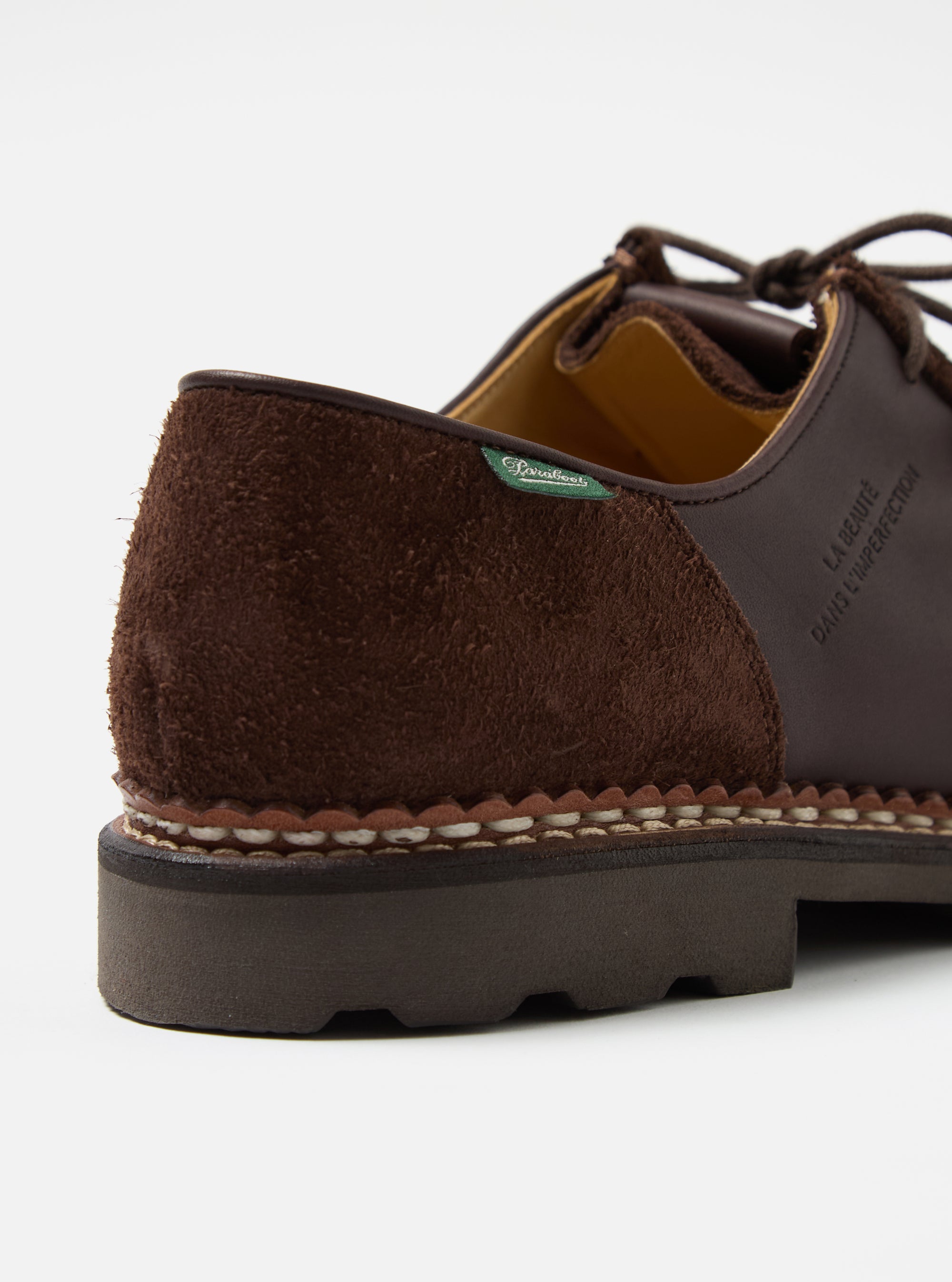 Close-up of the Paraboot x Universal Works Michael in Coffee Leather/Suede. The shoe features brown leather and suede, with a thick sole. Shot on a white background.