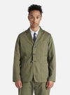 A model wears a Light Olive Twill London Jacket. The twill jacket is styled with a white shirt and navy tie, against a plain white backdrop.