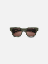 A. SOCIETY x Universal Works Olive Stanley Sunglasses on a white background. The frames are olive green and the lenses are brown.