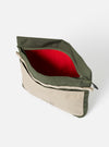 The Topologie x Universal Works Rifle Green UW Tech Musette Medium bag. It's open, showing a red interior, with a beige pocket on a white background.