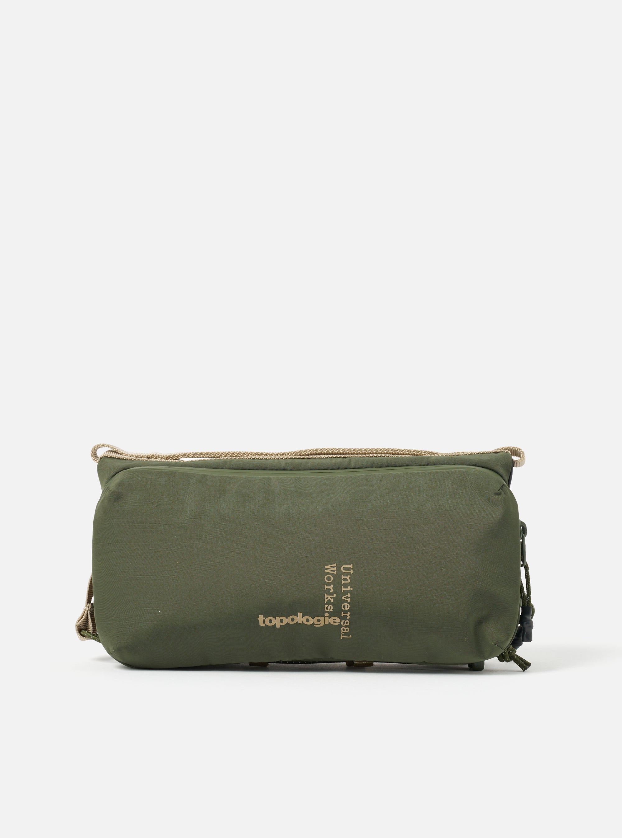 Topologie x Universal Works Rifle Green UW Tech Bottle Sacoche Medium on a white background. The bag is rifle green with beige straps and black zipper pulls.