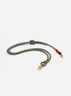 The Topologie x Universal Works Red Hitch UW Rope 8mm Rope Strap on a white background. The rope is grey with gold hardware and red accents.
