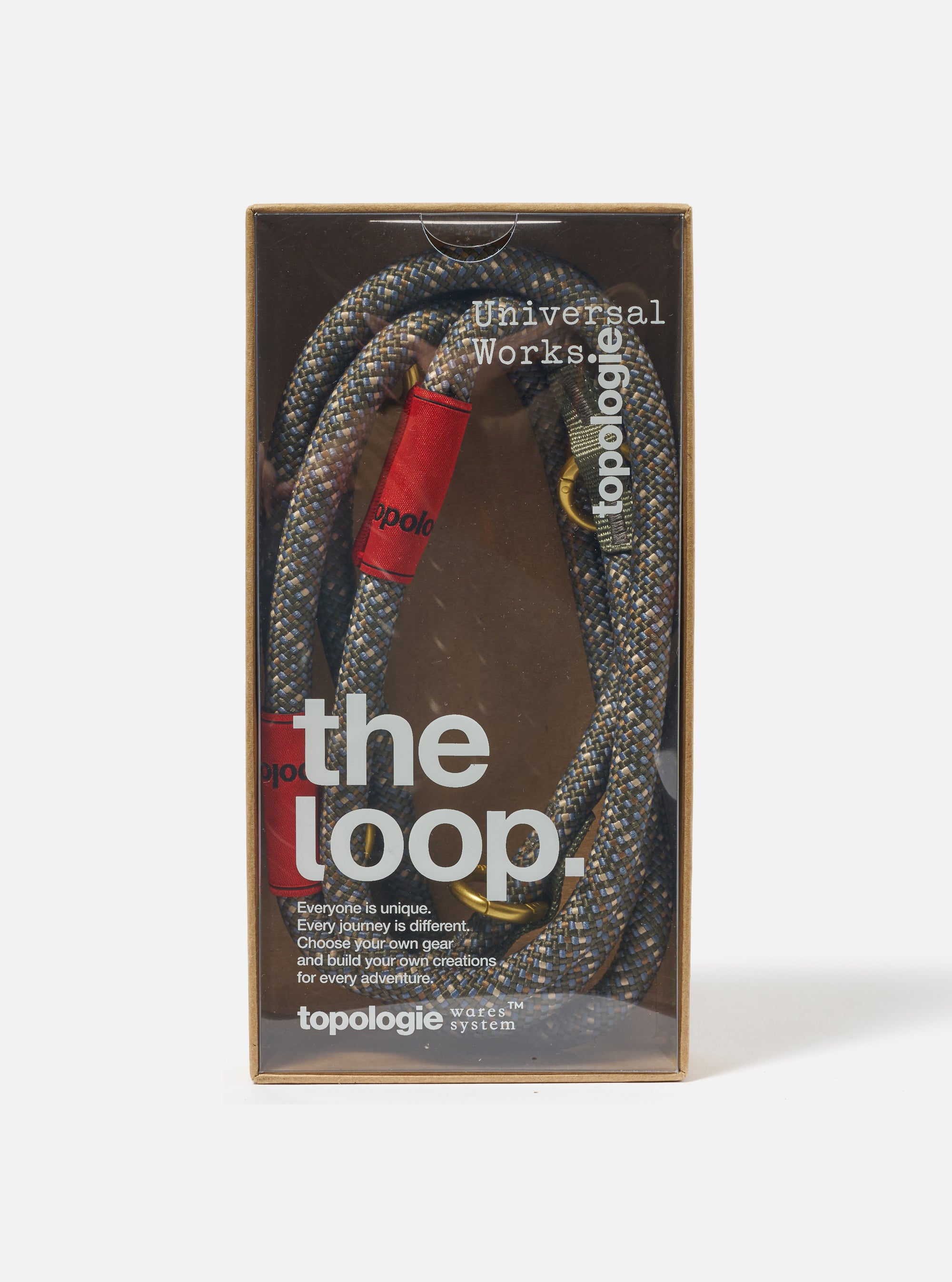 Close-up of the Topologie x Universal Works Olive Hitch UW Rope 10mm Rope Loop in its packaging. The rope is olive with blue accents and red fabric. Shot on a white background.