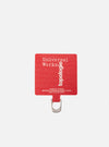 Close-up of the Topologie x Universal Works Red UW Tech Phone Strap Adapter on a white background. The red adapter features the logos of both brands.