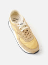 An angled front product shot of the Walsh x Universal Works Tornado in Beige Leather/Canvas on a white background, showcasing the rounded toe box, beige lace-up closure, and textured paneling.