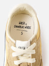 A view of the rubber outsole of the Walsh x Universal Works Tornado in Beige Leather/Canvas against a white background, highlighting the durable tread pattern and grip design for traction.