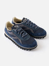 A top-down view of the Walsh x Universal Works Ensign in Navy Leather/Canvas sneaker shown on a plain white background, focusing on the laced tongue, inner collar lining, soft footbed, and rounded toe cap silhouette.