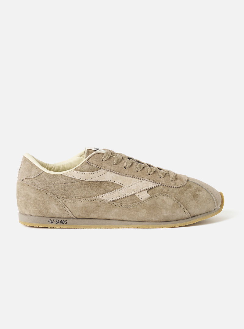 A product photograph featuring a pair of Walsh x Universal Works Cob shoes in Camel Leather positioned side-by-side against a plain off-white background, highlighting the smooth camel tan upper and cream outsole.