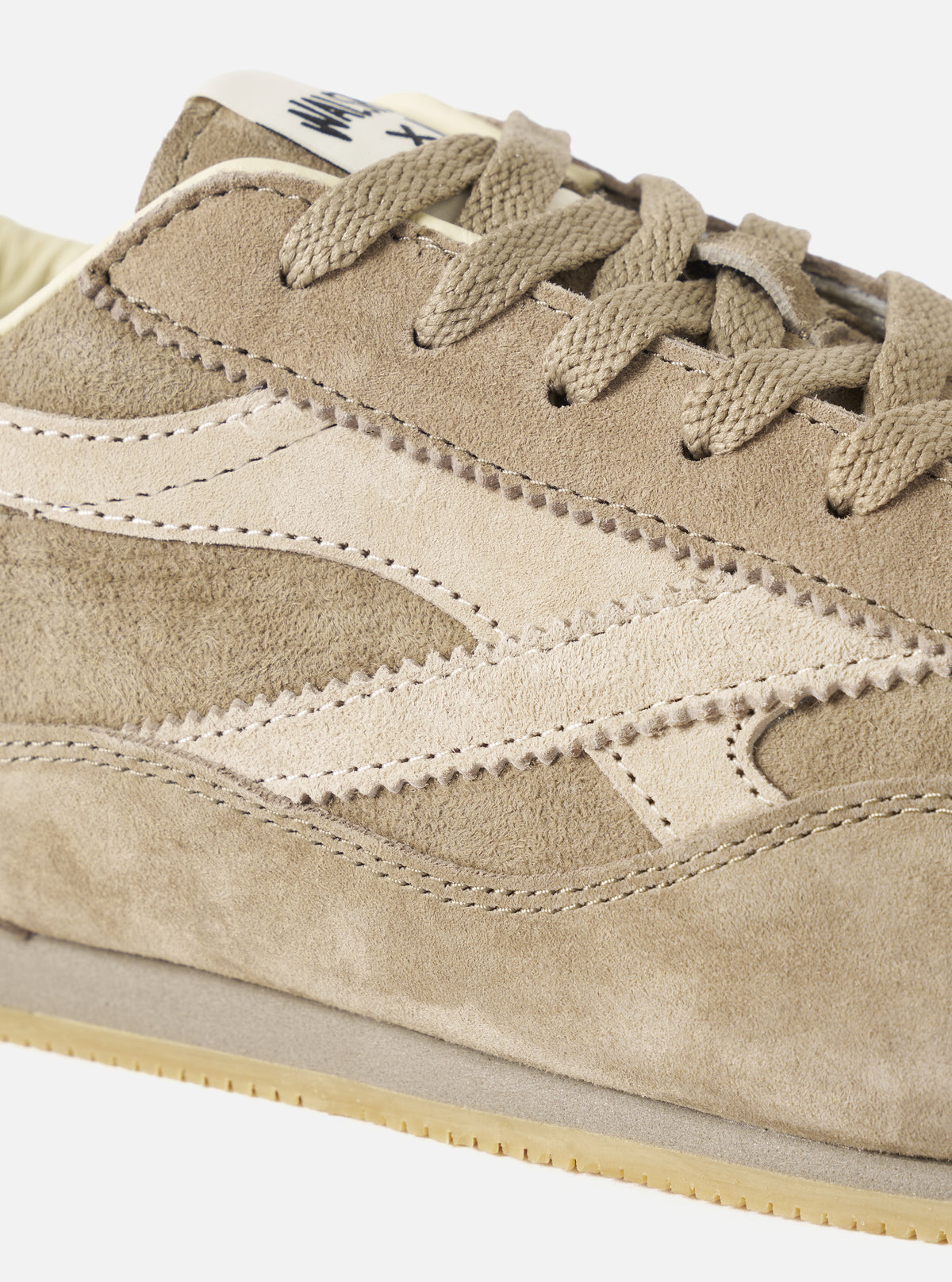 An angled front view of the Walsh x Universal Works Cob in Camel Leather on a plain background, focusing on the rounded toe box, tonal beige laces, and smooth leather panel construction across the upper.