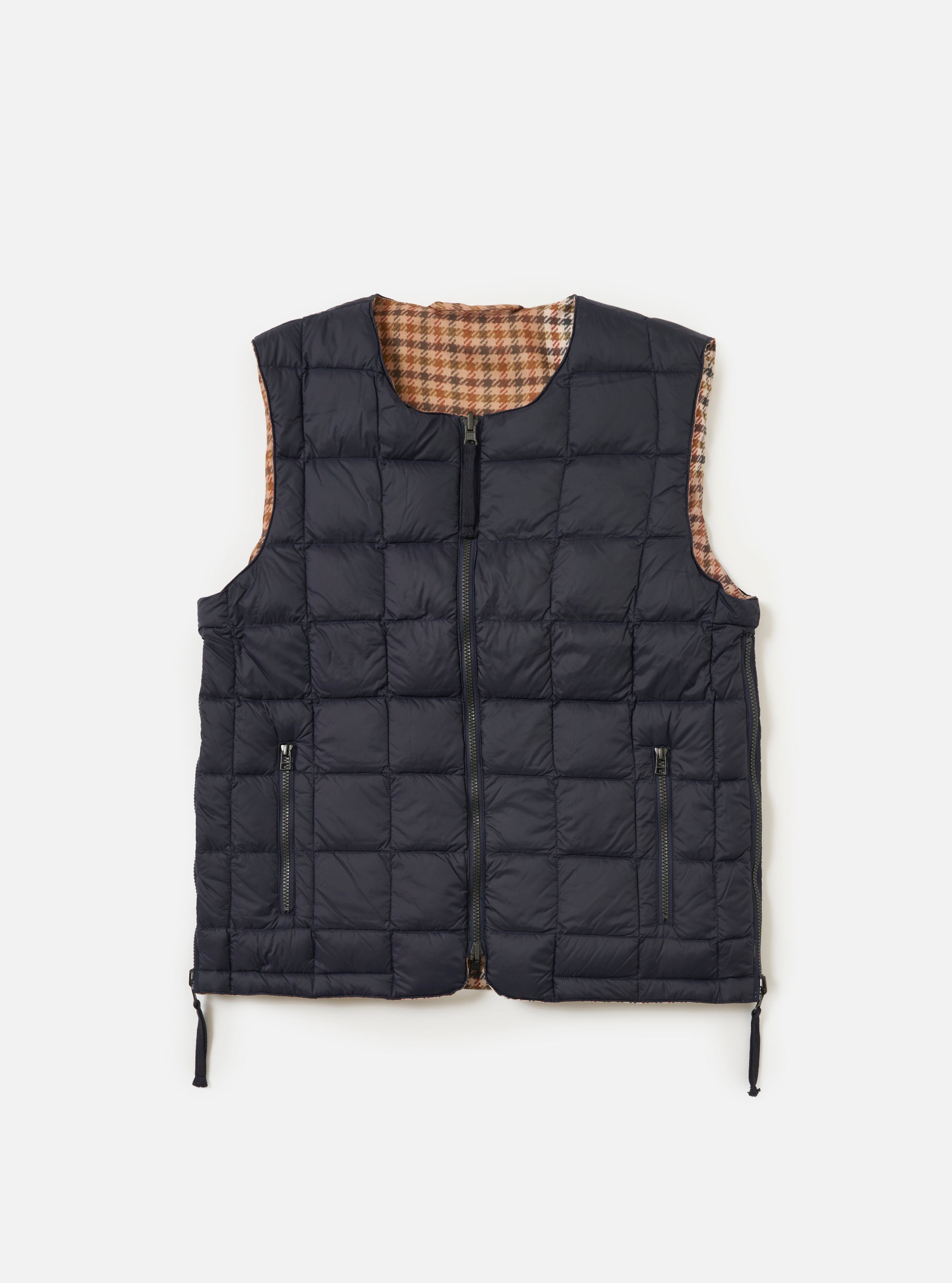 The TAION x Universal Works Reversible Dark Navy Military Line Vest on a white background. The vest is dark navy with a brown and tan houndstooth pattern on the reverse side.