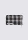 A. SOCIETY x Universal Works Green Aberdeen Sunglasses pouch. Plaid pattern in green, brown and white. Drawstring closure. Studio shot on white background.