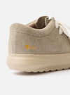 The Wander etc. FD/08 in Dust/Off White Suede/Leather is shown from a rear angle as a flat lay against a plain white background. The image highlights the light beige hairy suede heel panel, the chunky off-white rubber outsole, and the branded black pull tab at the heel.
