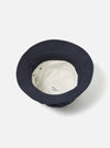 Close-up of the inside of a cableami® Navy Chino Cotton Loose Light Pork Pie Hat on a white background. Shows the light-colored lining and brand label.