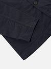 Close-up of the navy Linen Slub Weave Bakers Jacket on a white background, showcasing the fabric texture and button details.