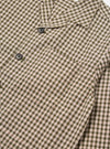Close-up of the Olive Dobby Check Cancun Jacket. Features an olive and white check pattern with brown buttons. The jacket is on a white background.