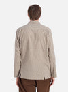 Back view of a model wearing the Olive Dobby Check Cancun Jacket. The jacket has a green and white check pattern. The background is a plain white studio backdrop.