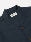 Close up of the Navy Broadcloth Cancun Jacket on a white background. The jacket is navy with brown buttons and a visible brand label.